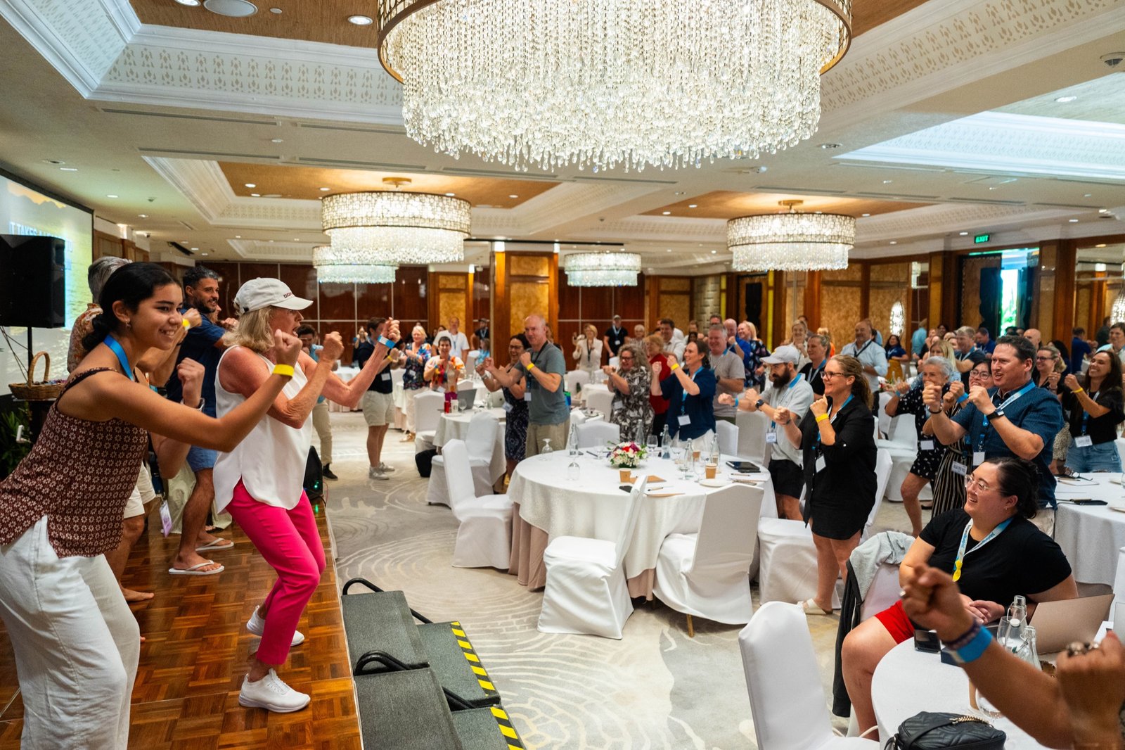 An audience enthusiastically participating with Lisa